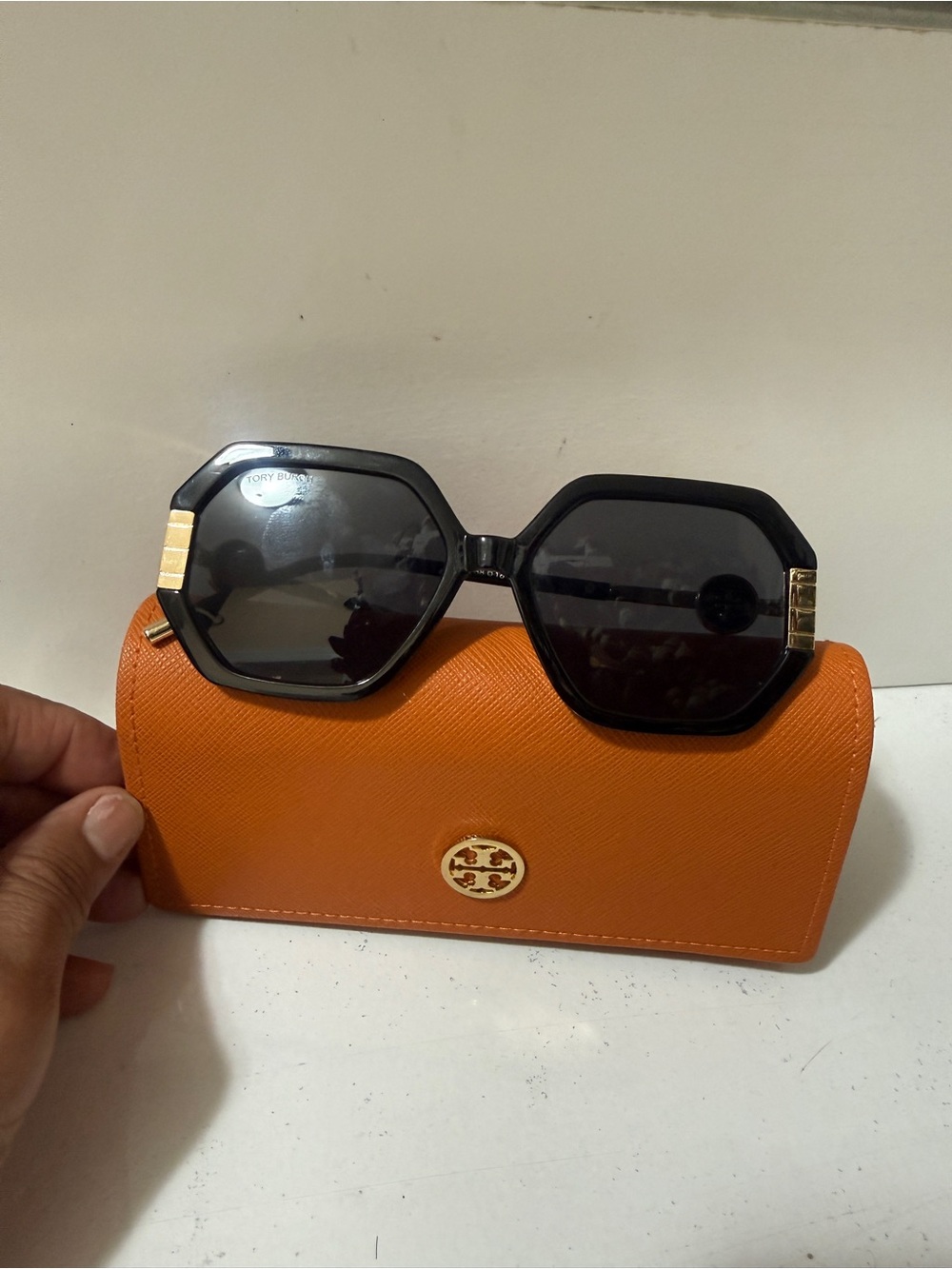 Tory Burch Black Geometric Sunglasses with Orange Case.